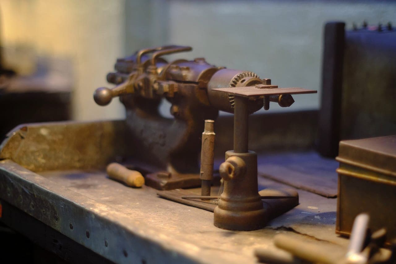 Preserved time-capsule workshop interior of the Smith & Pepper factory — benches, tools and machinery left in place since 1981