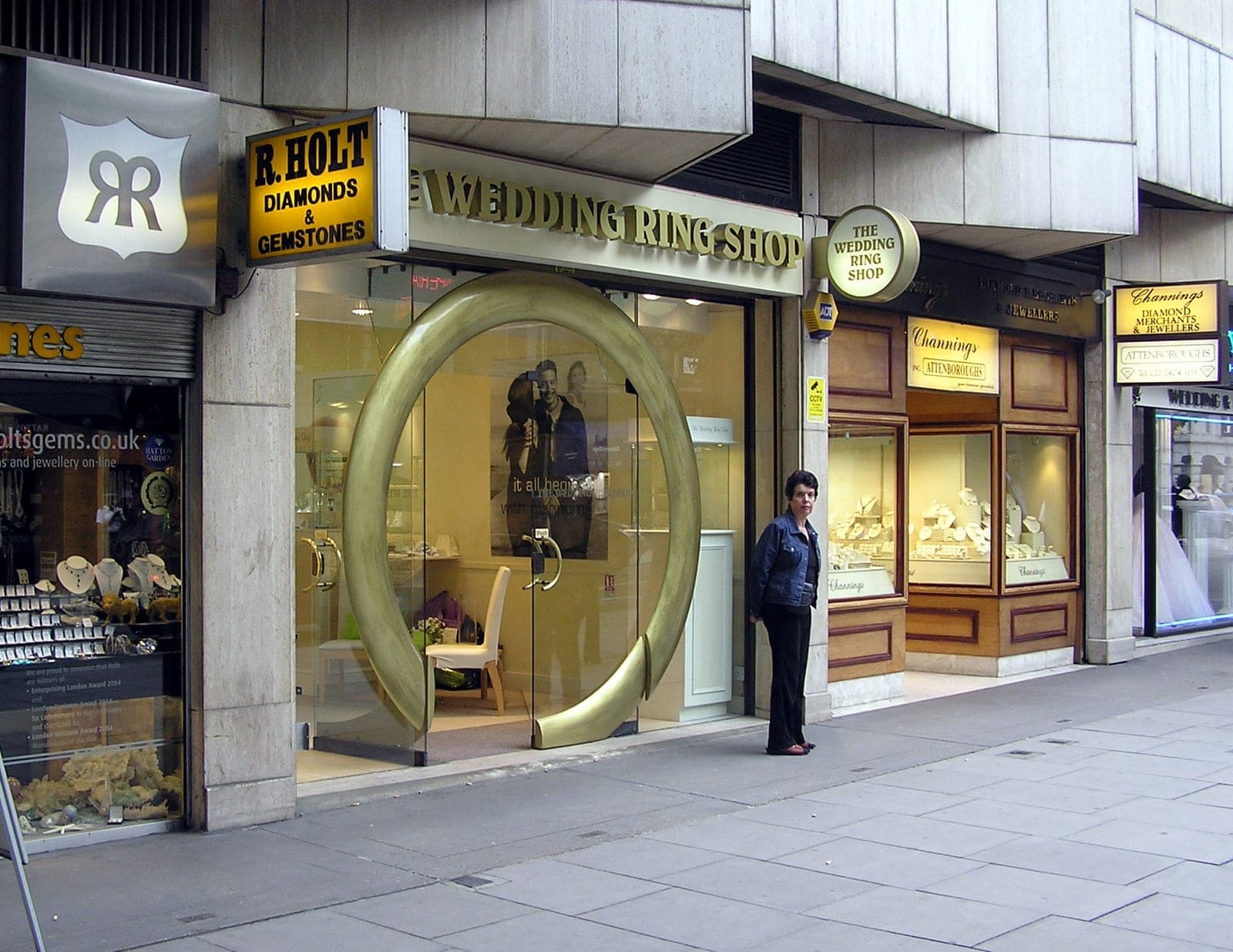Jewellery shop windows / engagement-ring displays along Hatton Garden — the bespoke engagement-ring retail character