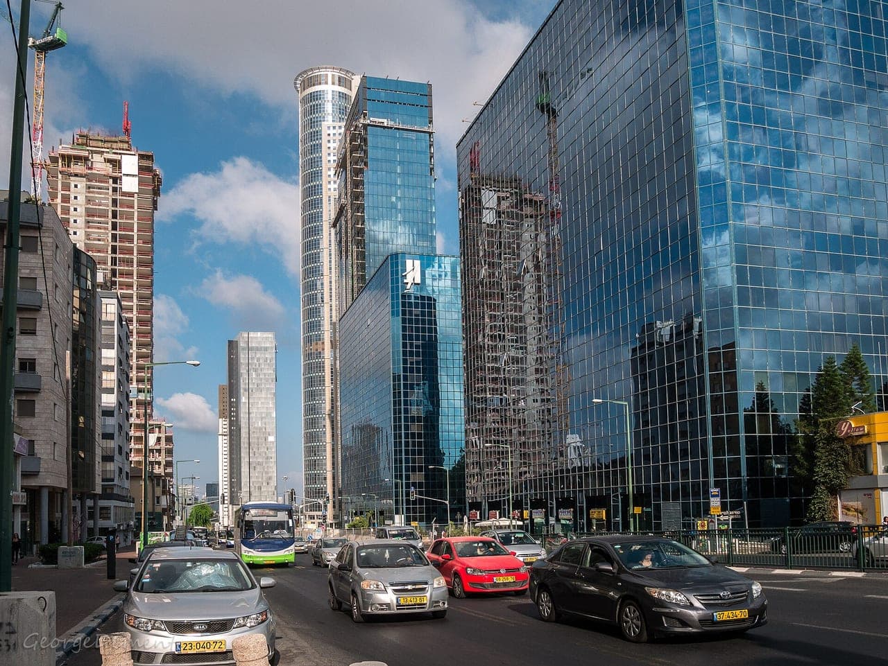 The four interconnected diamond-exchange towers in Ramat Gan seen together, ideally showing the elevated bridges that link them into one complex