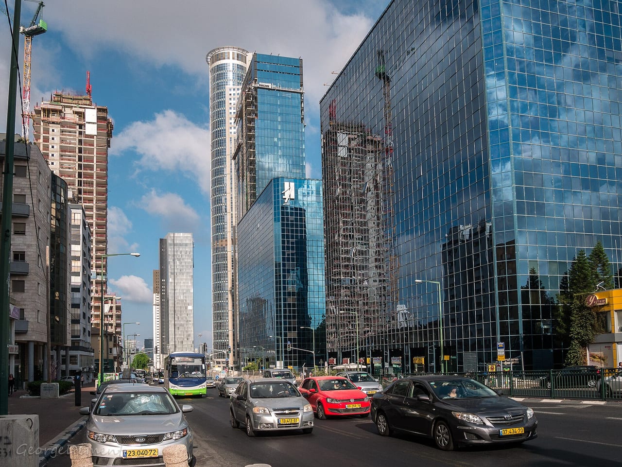 The four interconnected diamond-exchange towers in Ramat Gan seen together, ideally showing the elevated bridges that link them into one complex