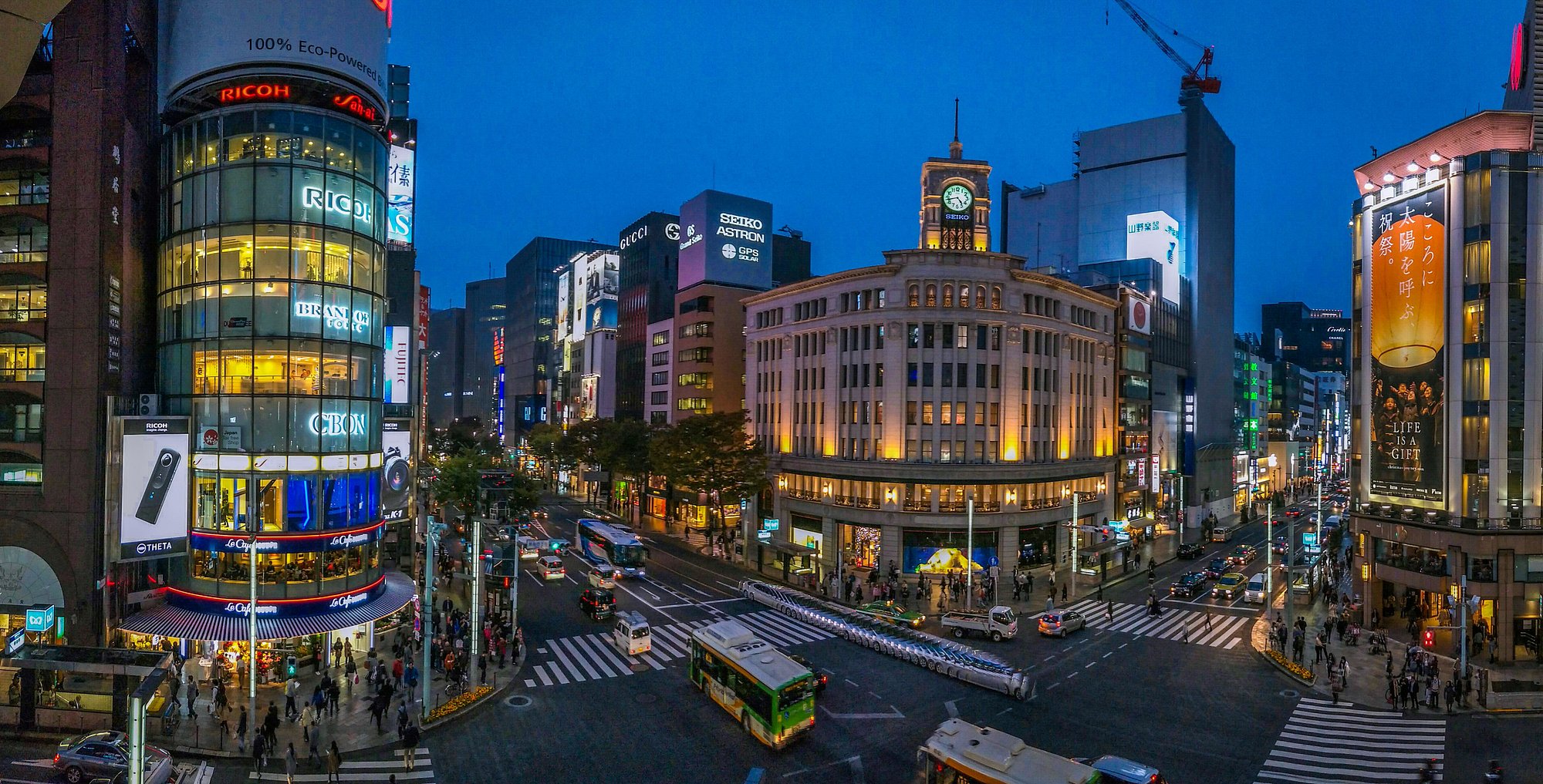 Ginza 4-chome crossing at dusk featuring the iconic Wako building and bustling shopping district
